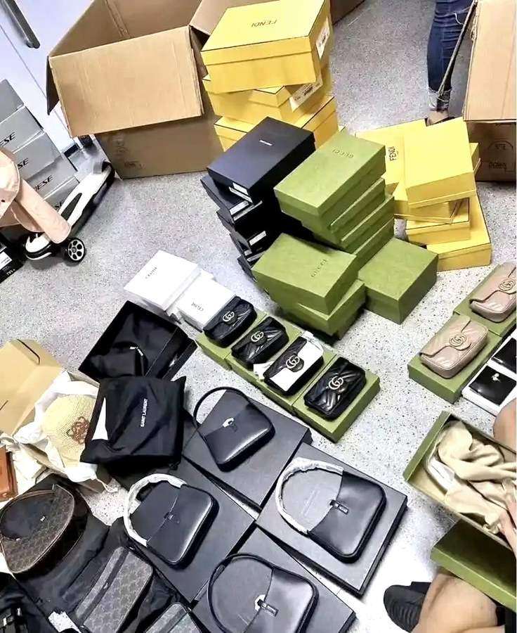 Batch of luxury bags from Gucci, Fendi, Celine and Saint Laurent boxed for dispatch