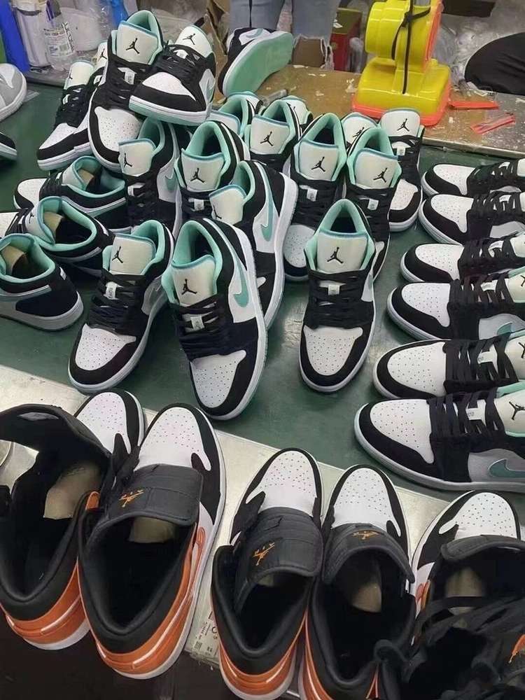 Fresh batch of mint and black Air Jordan sneakers on the factory line